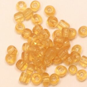 Seed beads transperant guldröd 4 mm